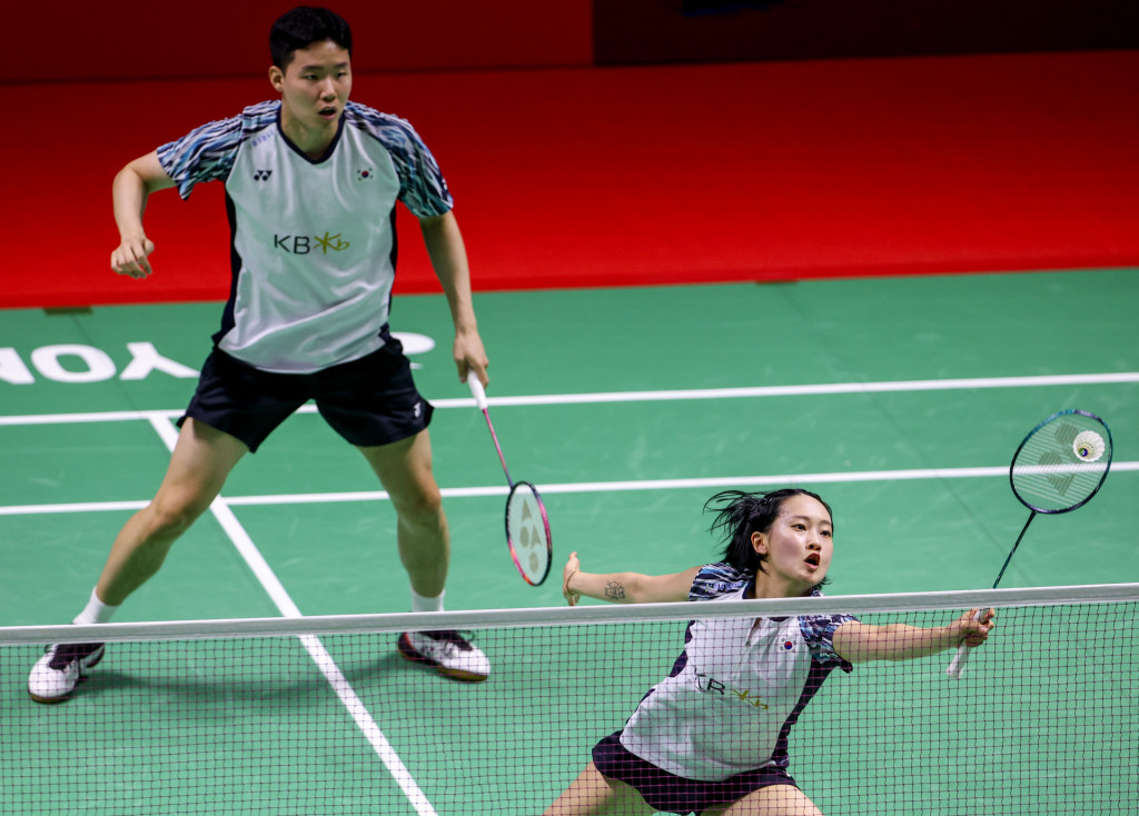 Rahayu (right) and Ramadhanti celebrate their victory over the No.2 seeds.