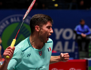All England: Defending Champ Falters in Opening Test